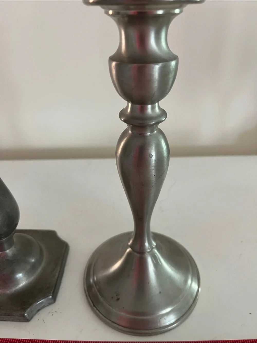Unmatched set of 2 8 inch pewter candlesticks no visible markings